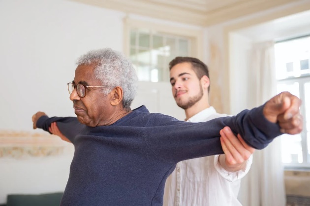 Older male patient with male caretaker